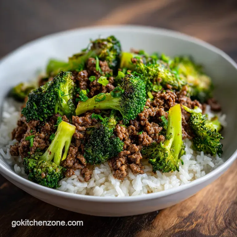 Steaming beef and broccoli served in a white bowl, topped with sesame seeds; chopsticks rest on the side.