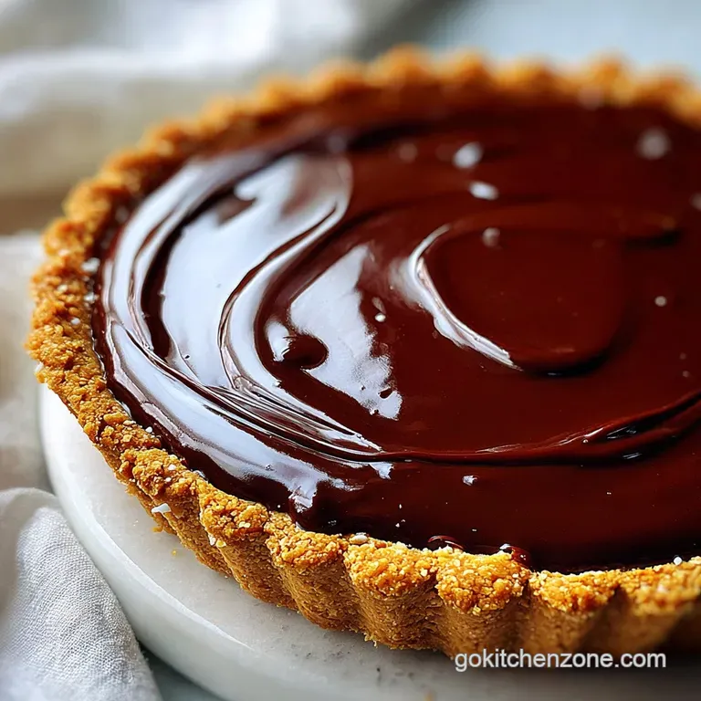 Slice of peanut butter pie, chocolate ganache glistening, on a plate with chocolate shavings. Inviting dessert!