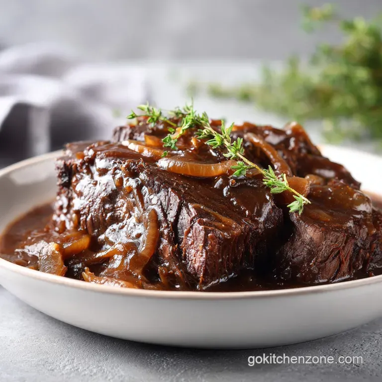 Elegantly plated tender beef medallions with honey-glazed carrots and fluffy potatoes on a white ceramic plate.